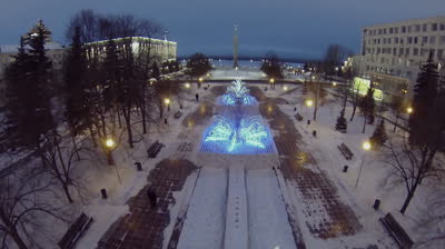 samara small park with shiny adornments near glory square at winter evening