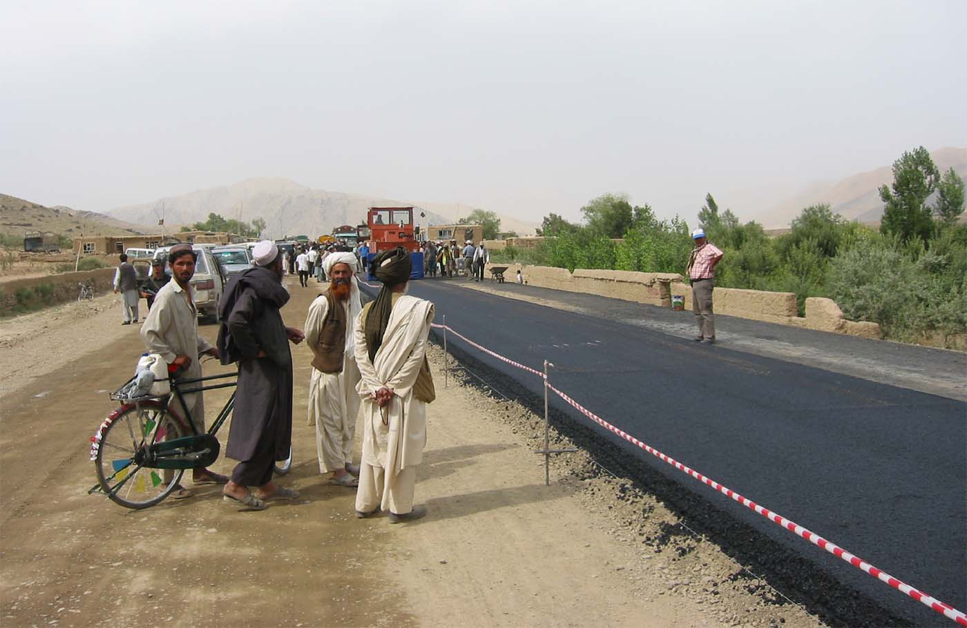 Men watching road work on Kabul Kandahar Highway in 2003